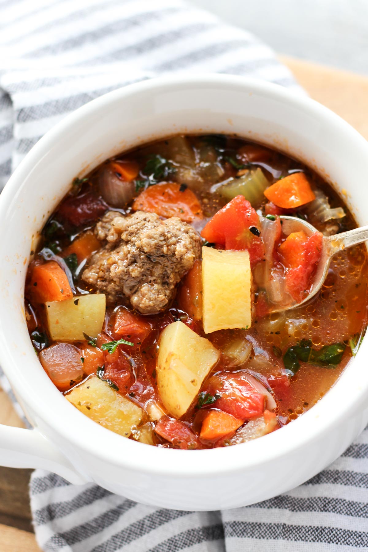 Bowl of hearty italian meatball soup.