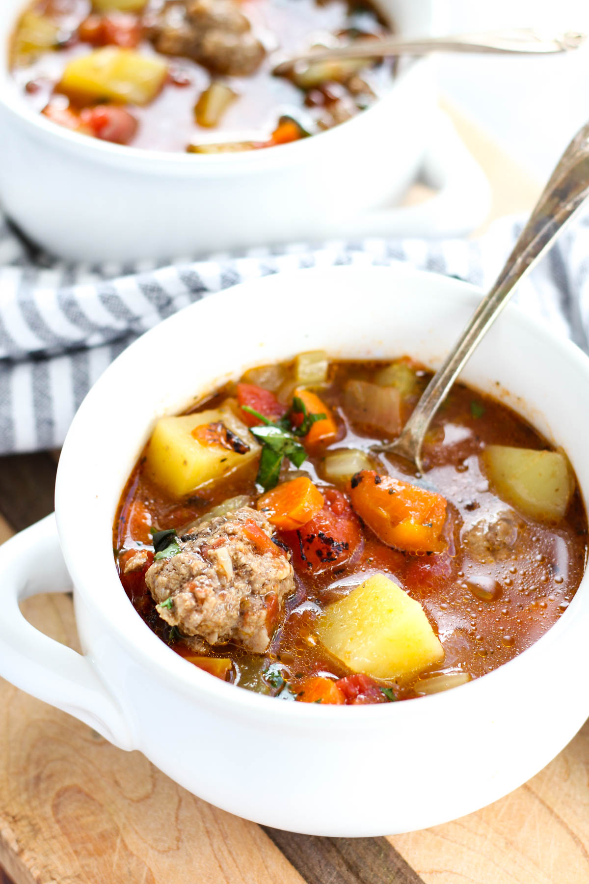 Side angle picture of two bowls of soup.