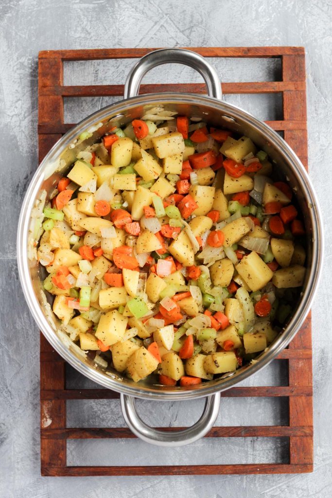 All vegetables sautéing in the soup pot.