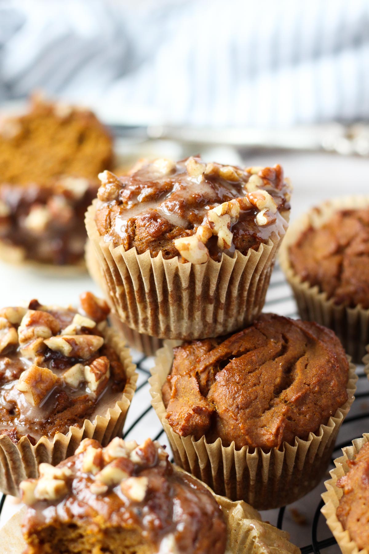 Pumpkin spice muffins stacked on top of each other.