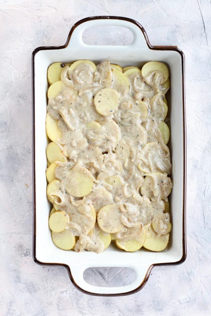 Potatoes thinly sliced and layered with cream sauce.