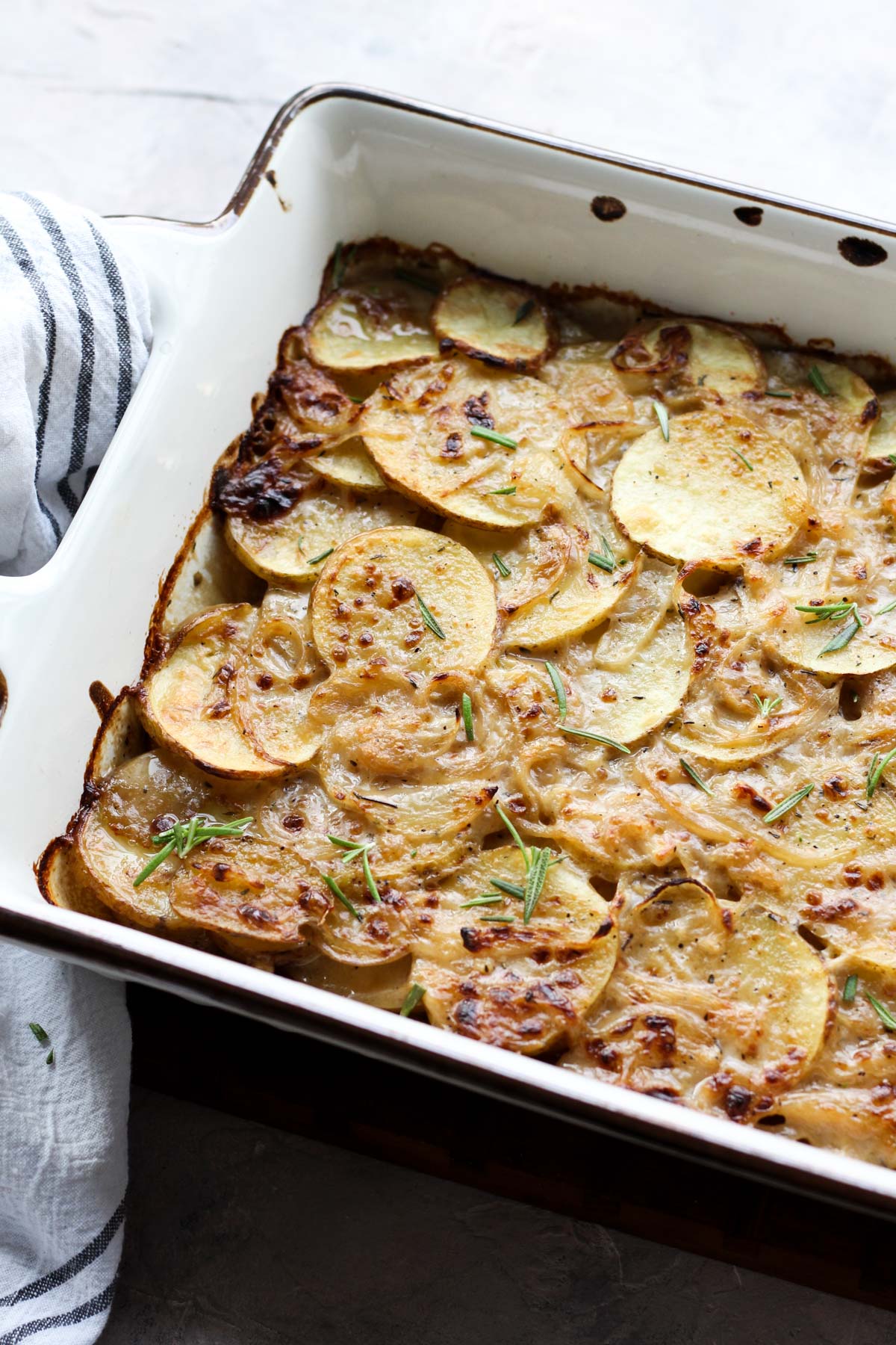 Casserole dish with crispy scalloped potatoes.