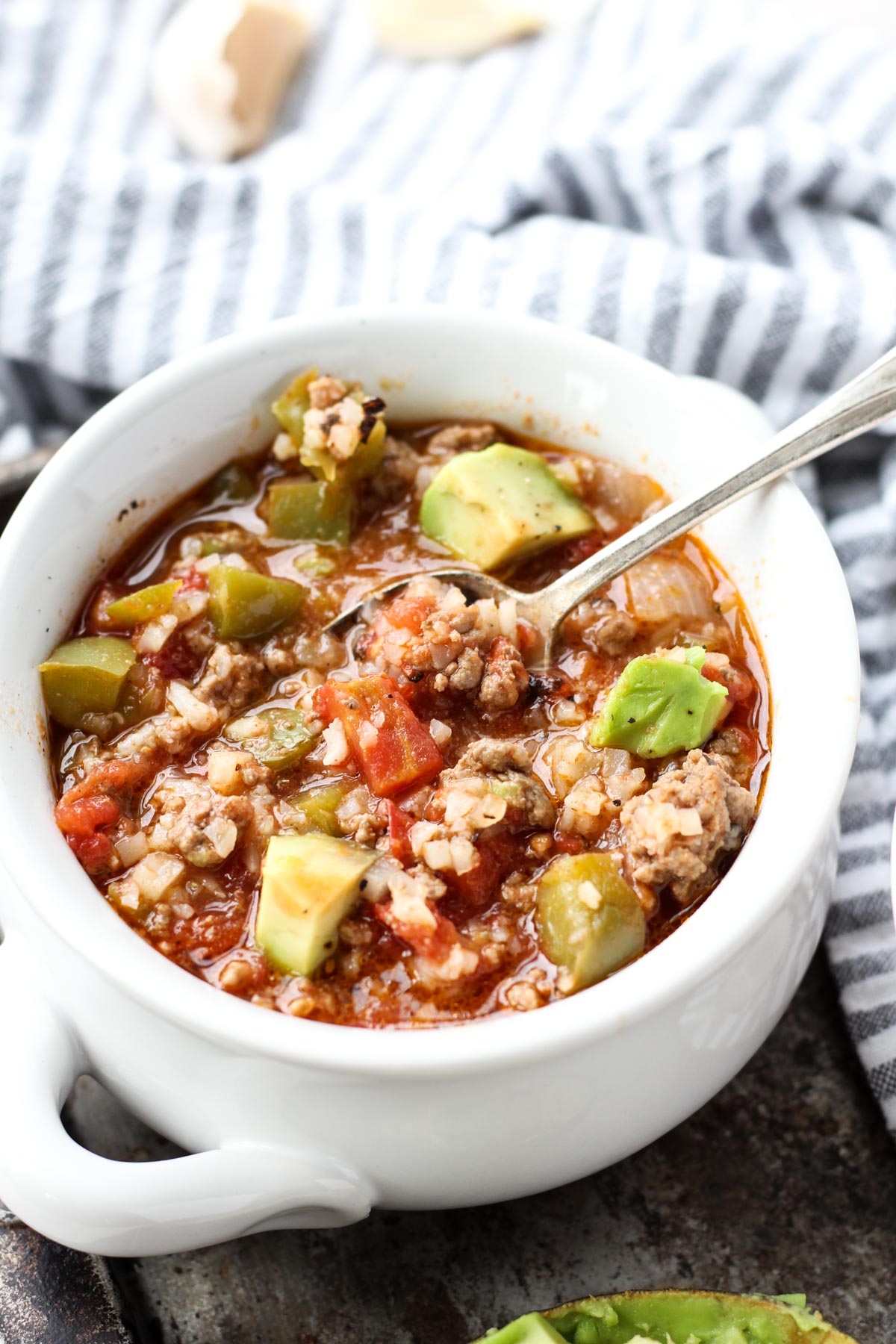 White bowl of stuffed pepper soup.
