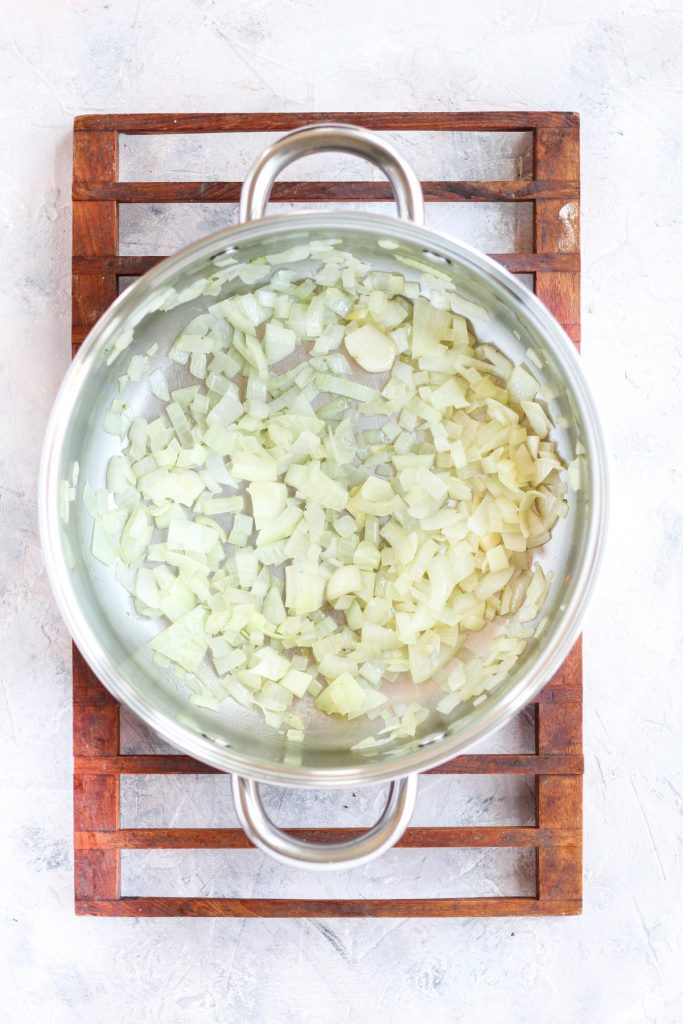 Large pot with onions and garlic.