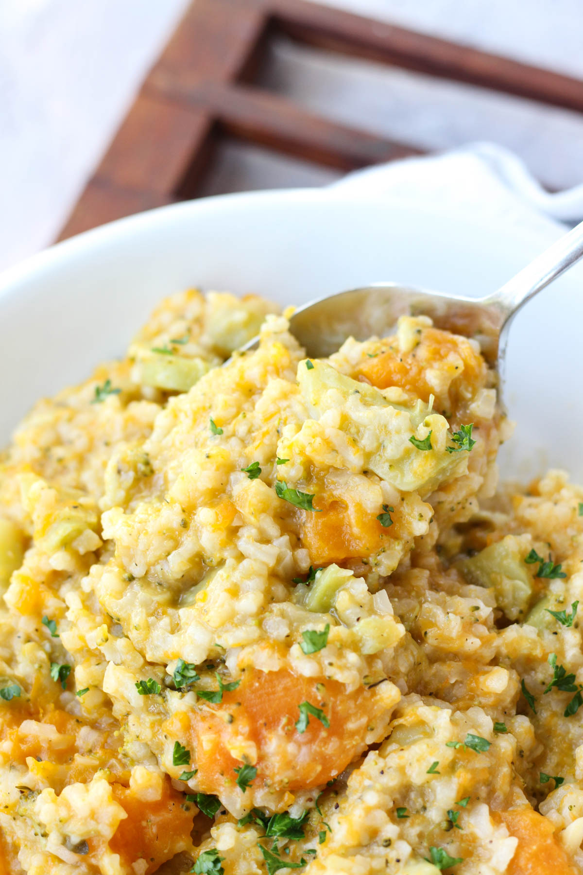 Spoon scooping creamy butternut squash risotto.