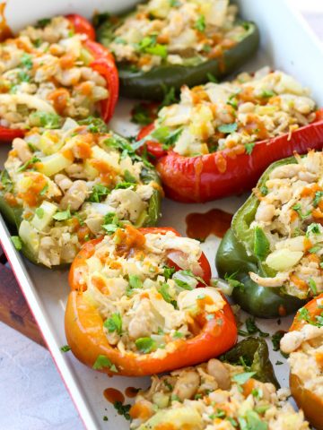 Buffalo chicken stuffed peppers in casserole dish.