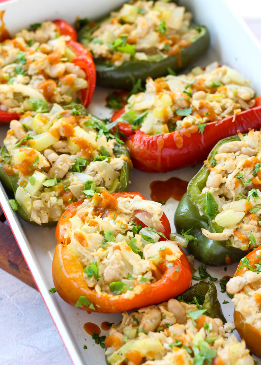 Buffalo chicken stuffed peppers in casserole dish.
