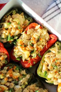 Buffalo chicken stuffed peppers in a casserole dish.