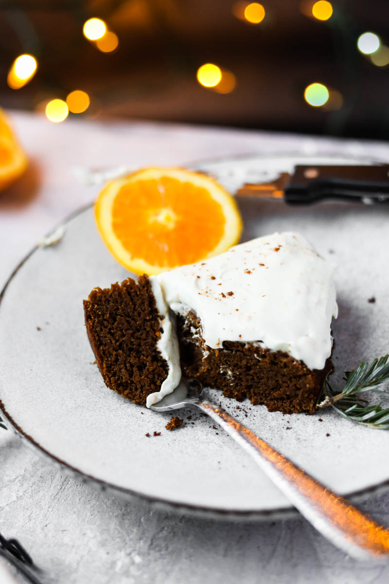 Slice of gingerbread orange cake with a fork.