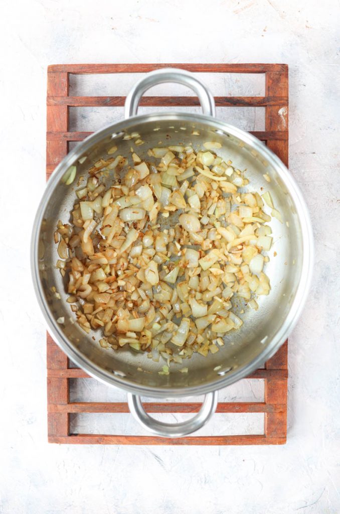 Sauteed garlic and onions in large pot.