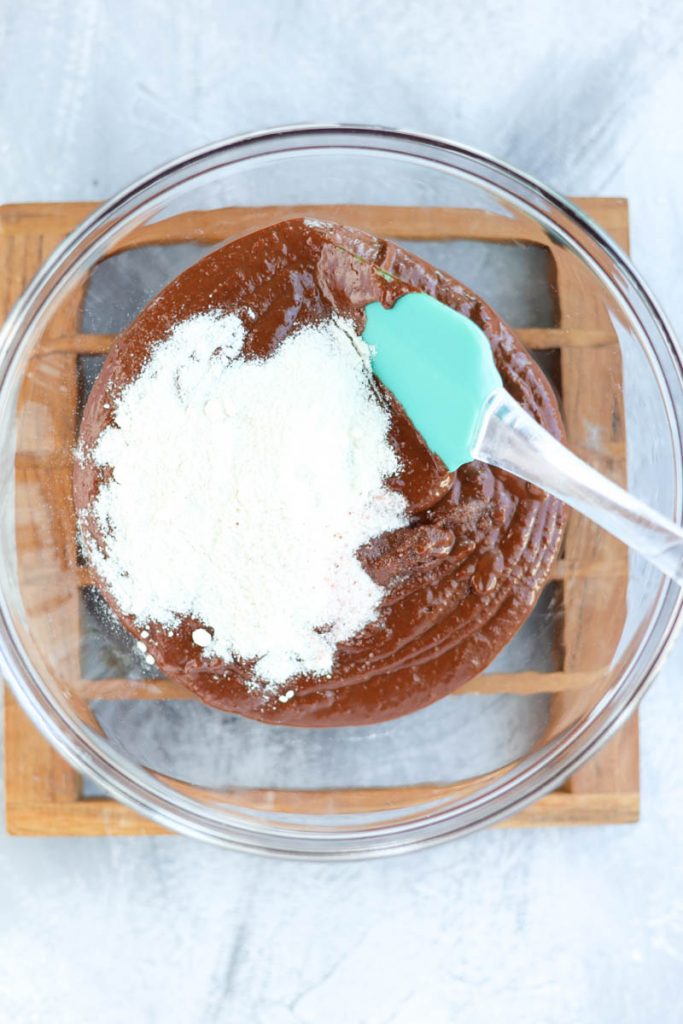 Folding coconut flour into truffle batter.