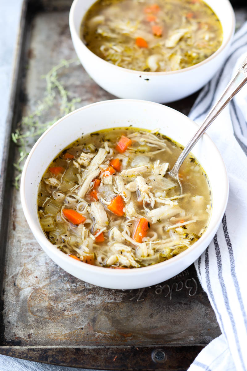 Bowl of chicken bone broth soup.