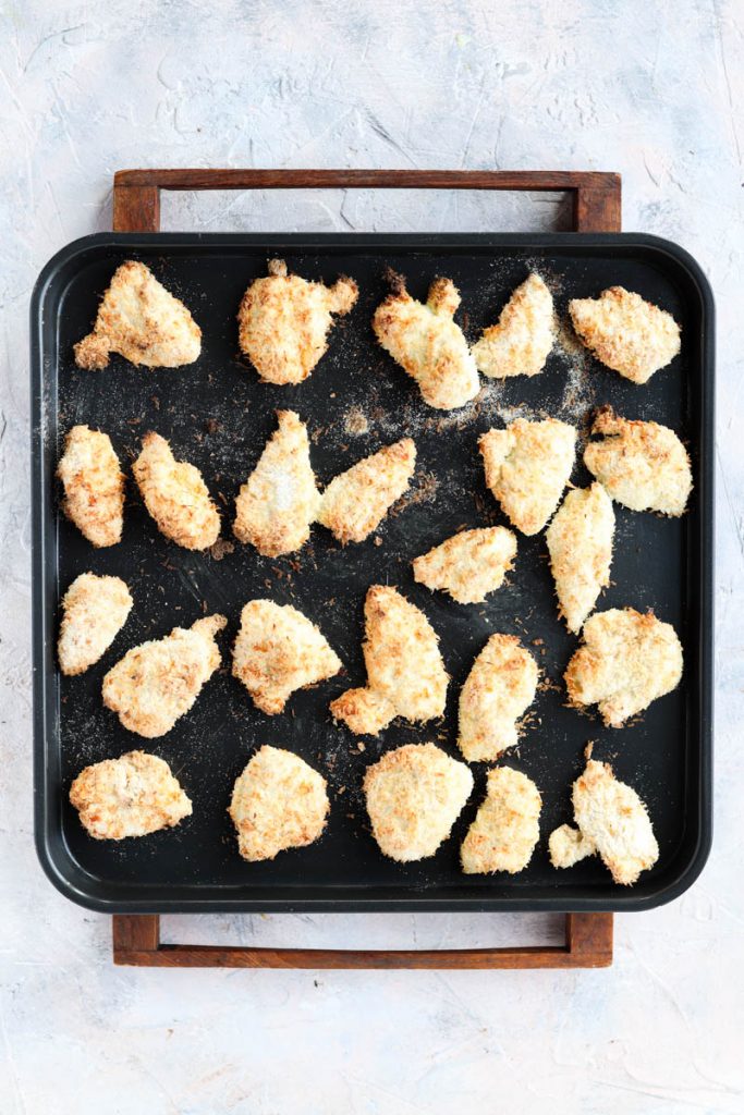 Air fried chicken on a baking tray.
