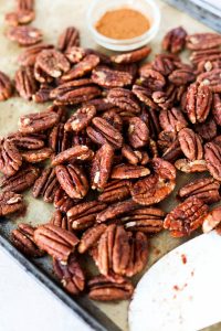 Baking sheet with candied pecans.