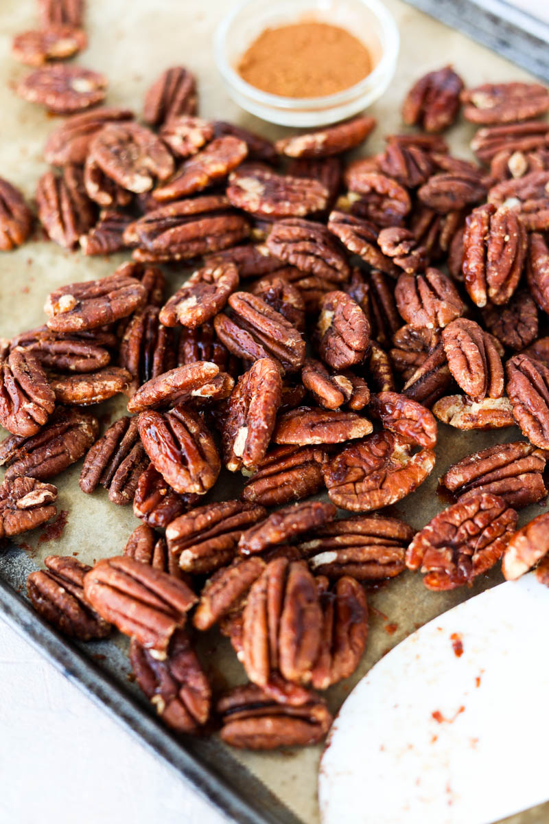 Baking sheet with candied pecans.