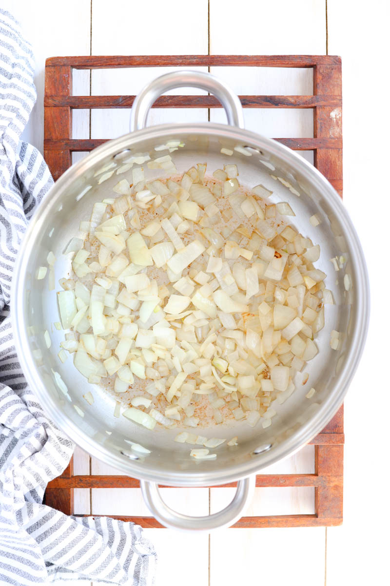 Onions cooking in pot.