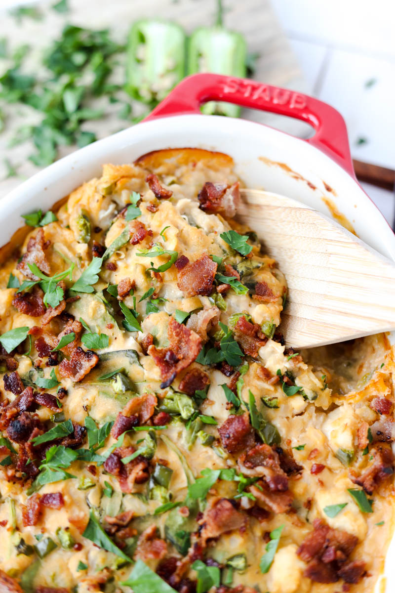 Spoon scooping out buffalo chicken casserole.