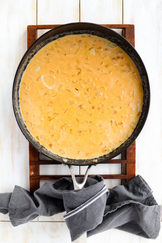 Sauce cooking in frying pan.