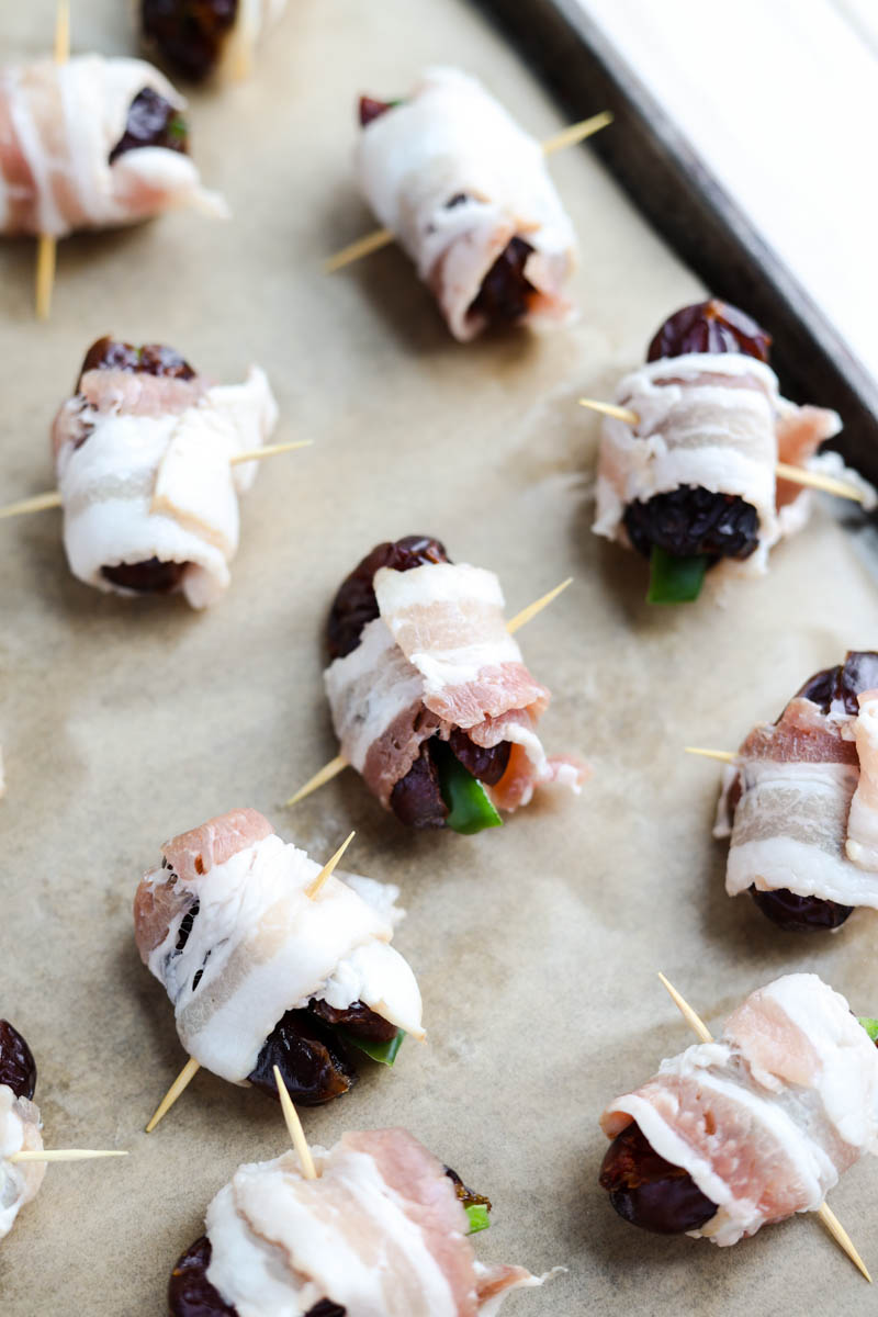 Close up picture of bacon wrapped dates.