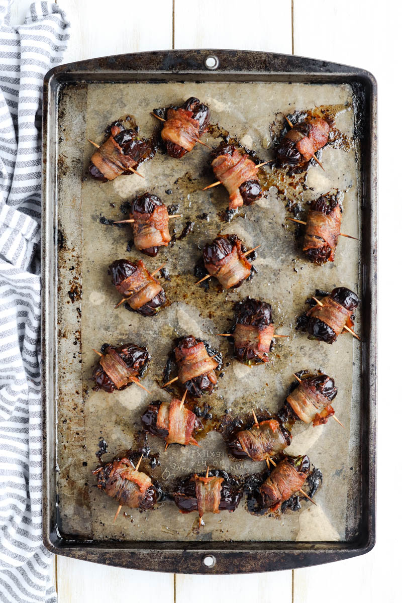 Cooked dates on a baking sheet.