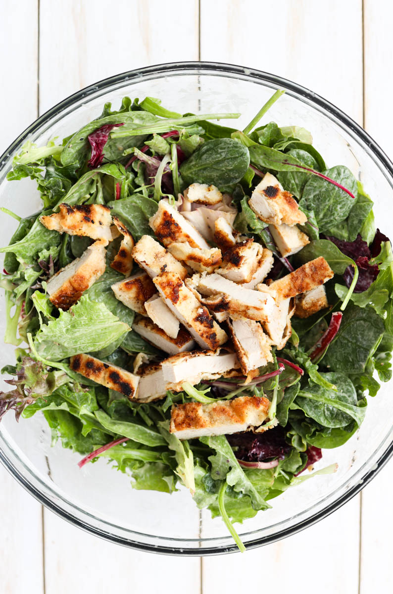 Chicken and lettuce in a large bowl.