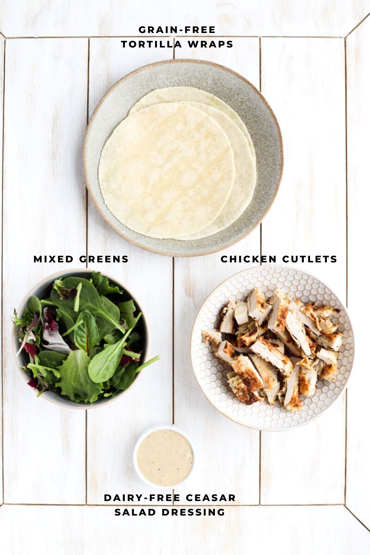 Overhead shot of crispy chicken Ceasar salad wrap ingredients.
