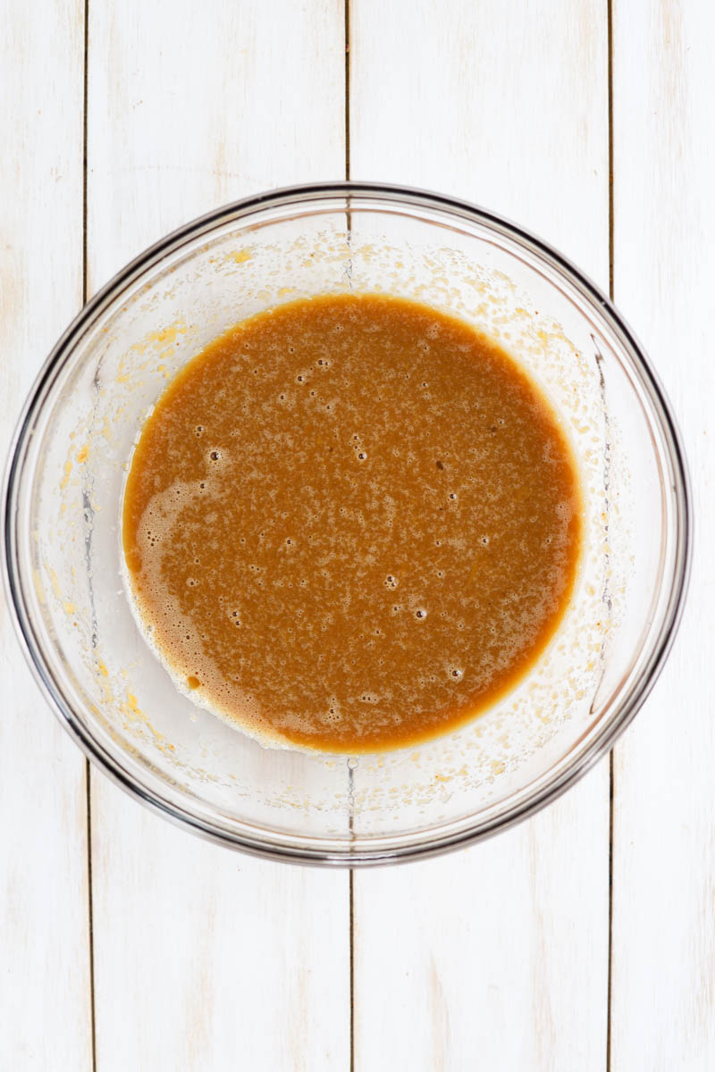 Wet ingredients in glass mixing bowl.