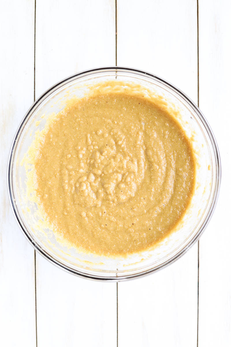 Cake batter in glass mixing bowl.