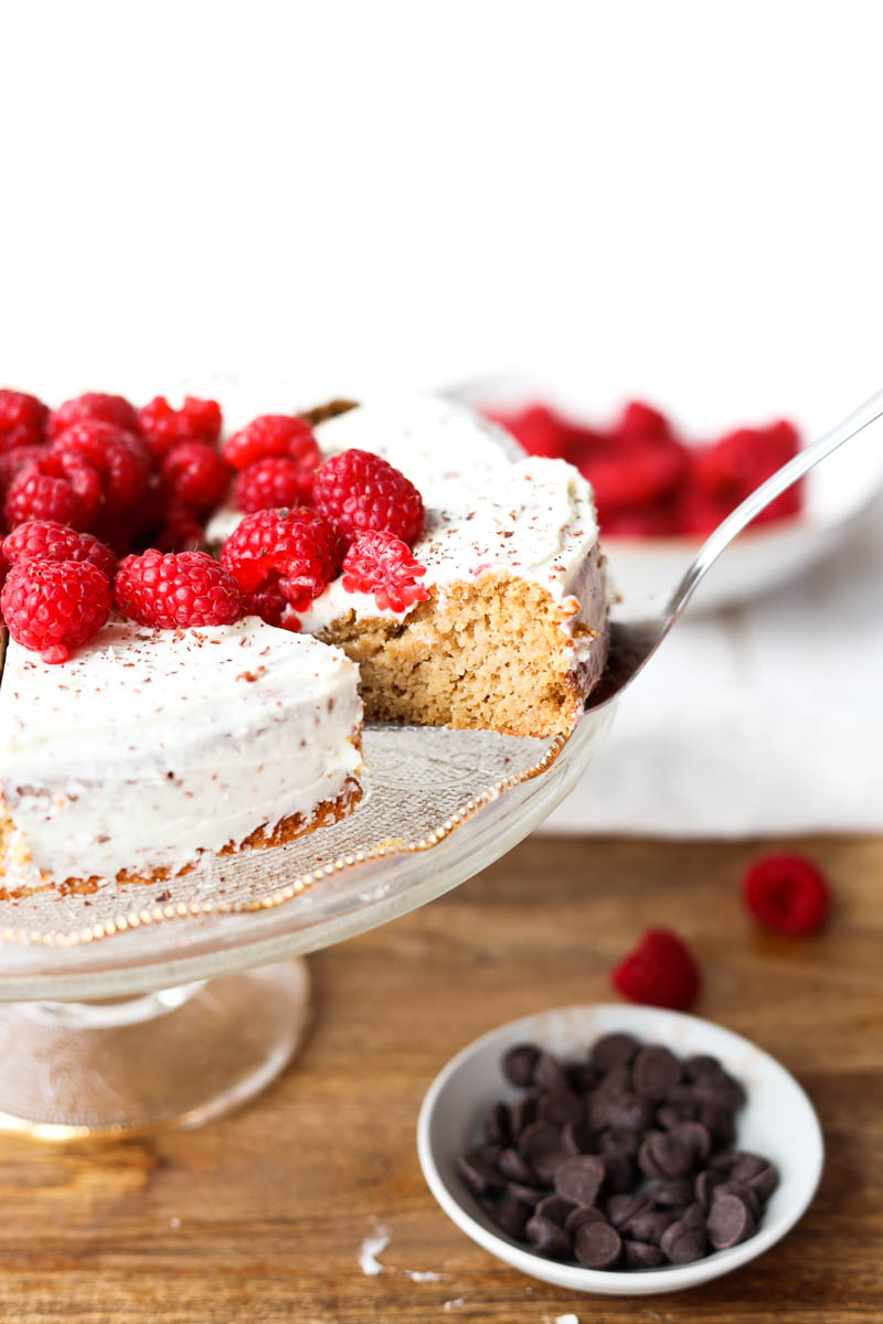 Pulling slice of cake off cake stand.