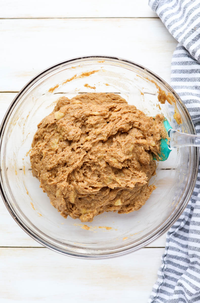 Banana bread dough in a glass mixing bowl.