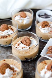 Cookie dough cups with a mini chocolate chip cookie on top.