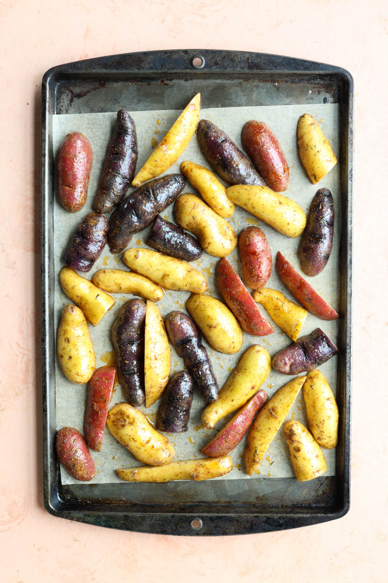 Fingerling potatoes on parchment paper.
