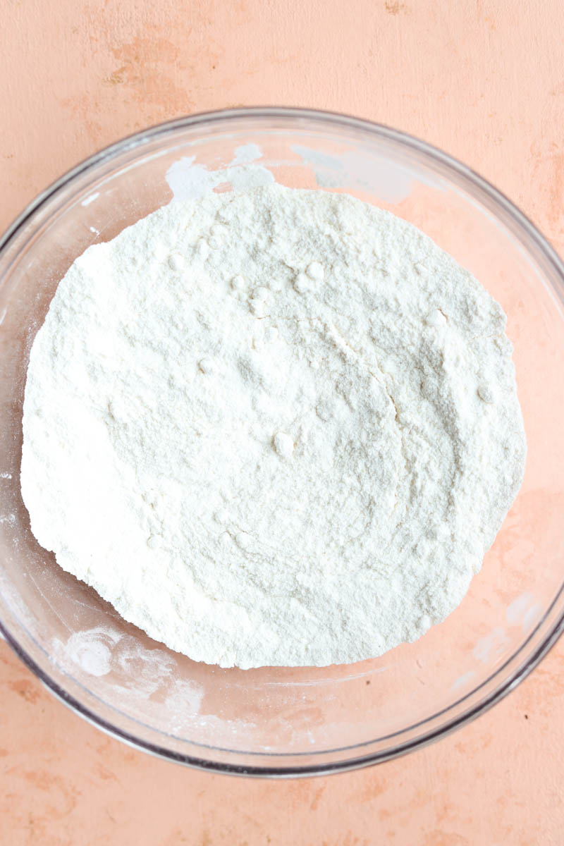 Dry ingredients in a glass mixing bowl.
