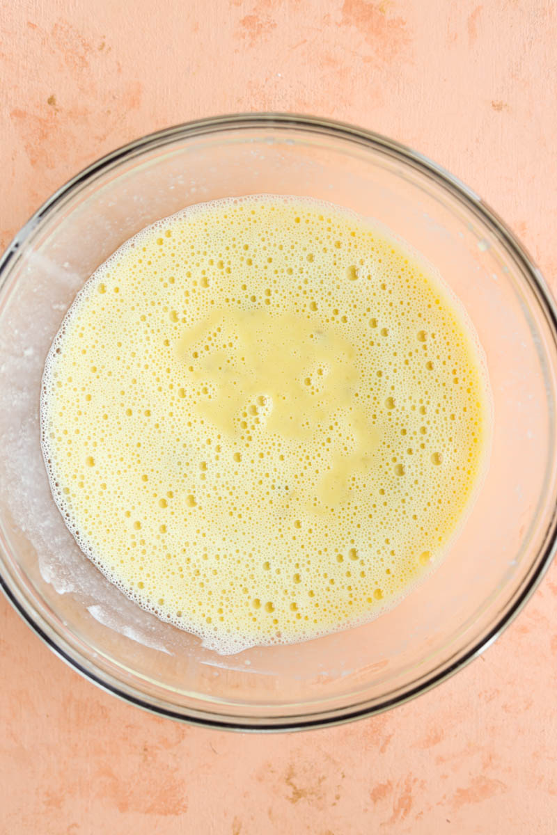 Wet ingredients in a glass mixing bowl.