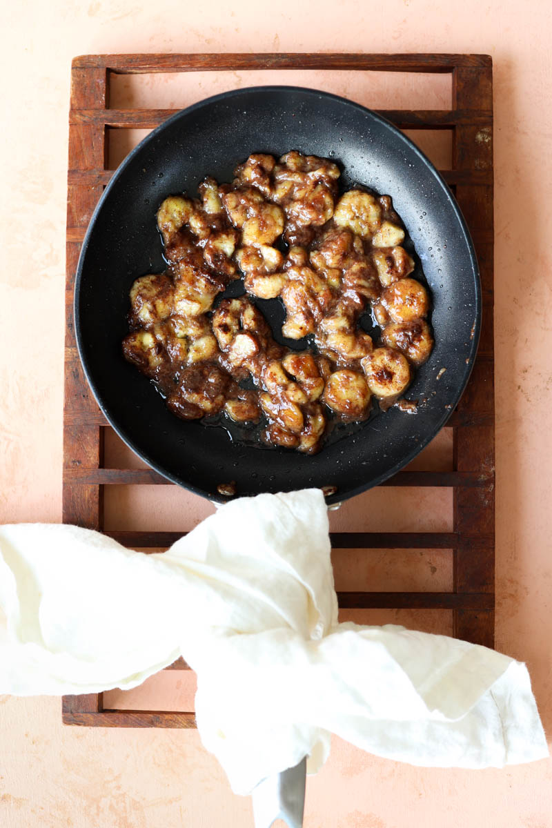Caramelized bananas in frying pan.