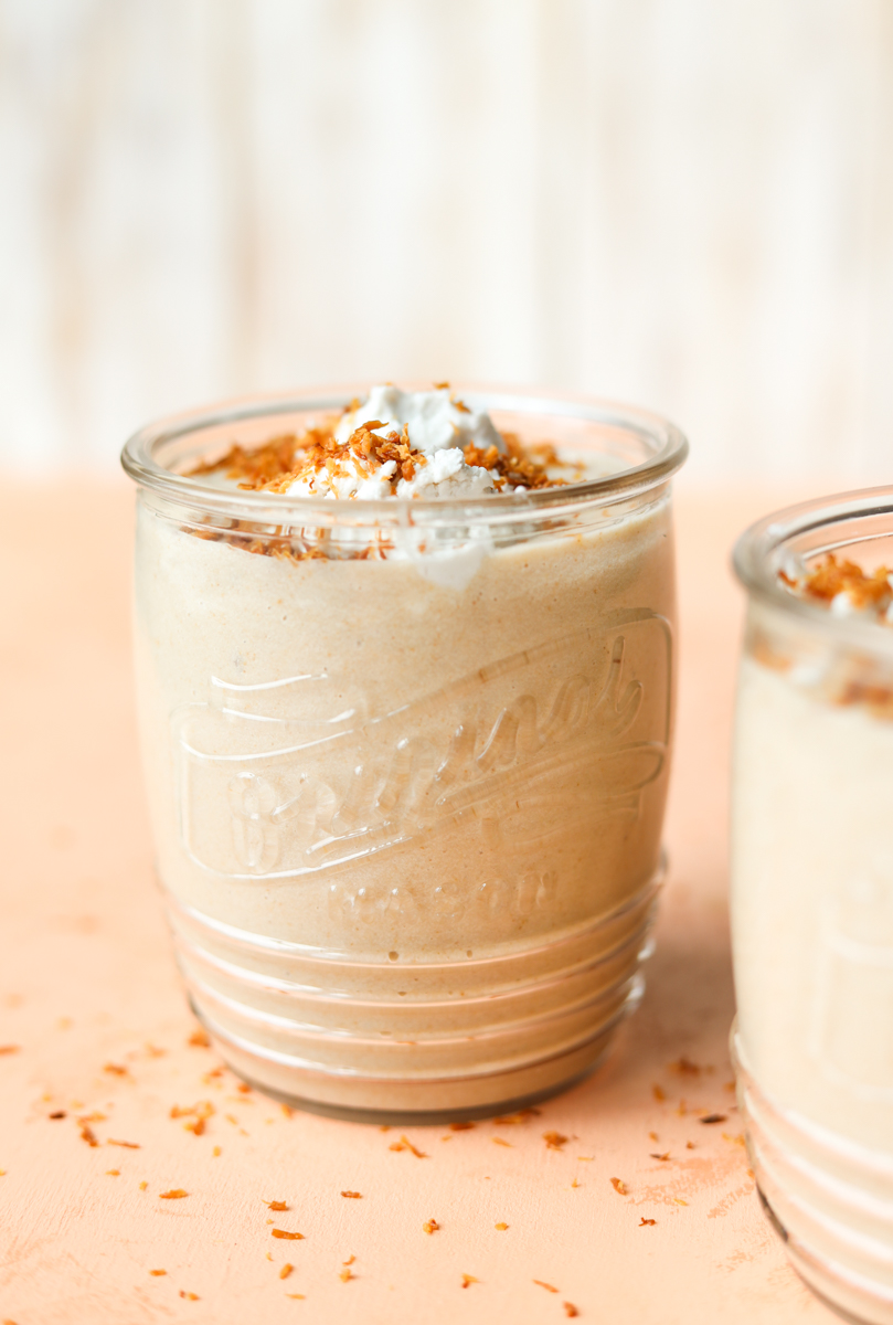 Glass jar with toasted coconut milkshake.