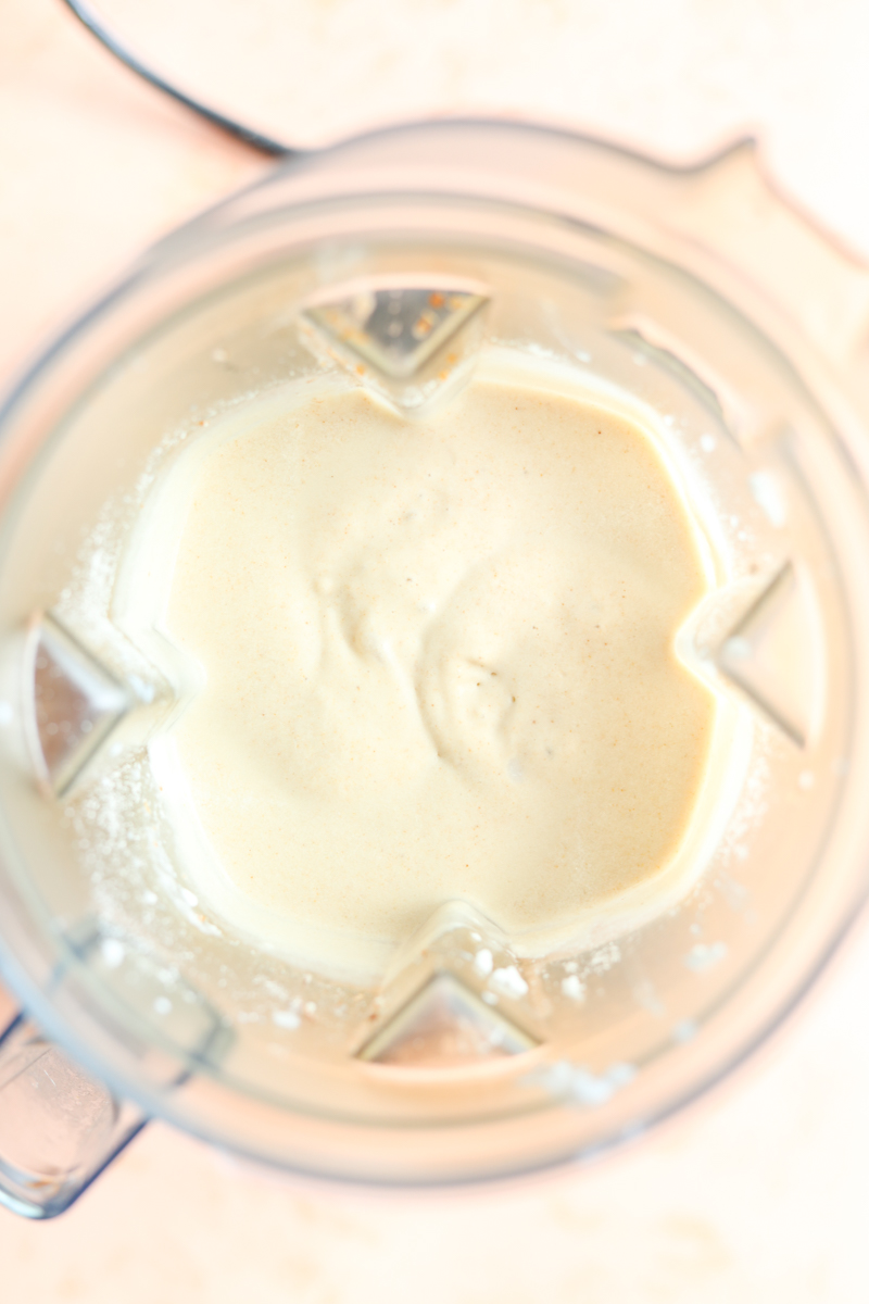 Thick coconut milkshake in blender.