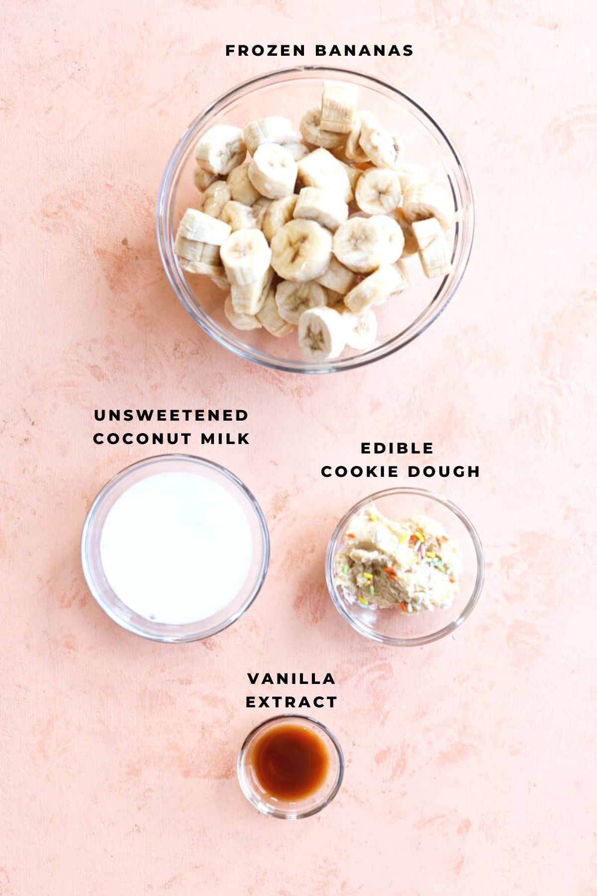 Ingredients for nice cream measured out in small bowls.