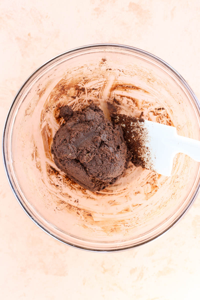 Chocolate cookie dough in glass bowl.