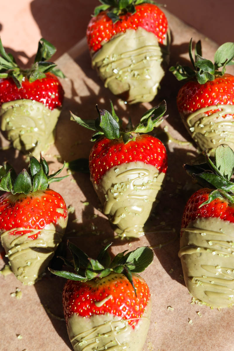 Chocolate covered strawberries on parchment paper.