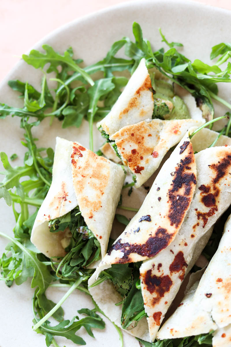 Pesto chicken wrap with golden brown outside.