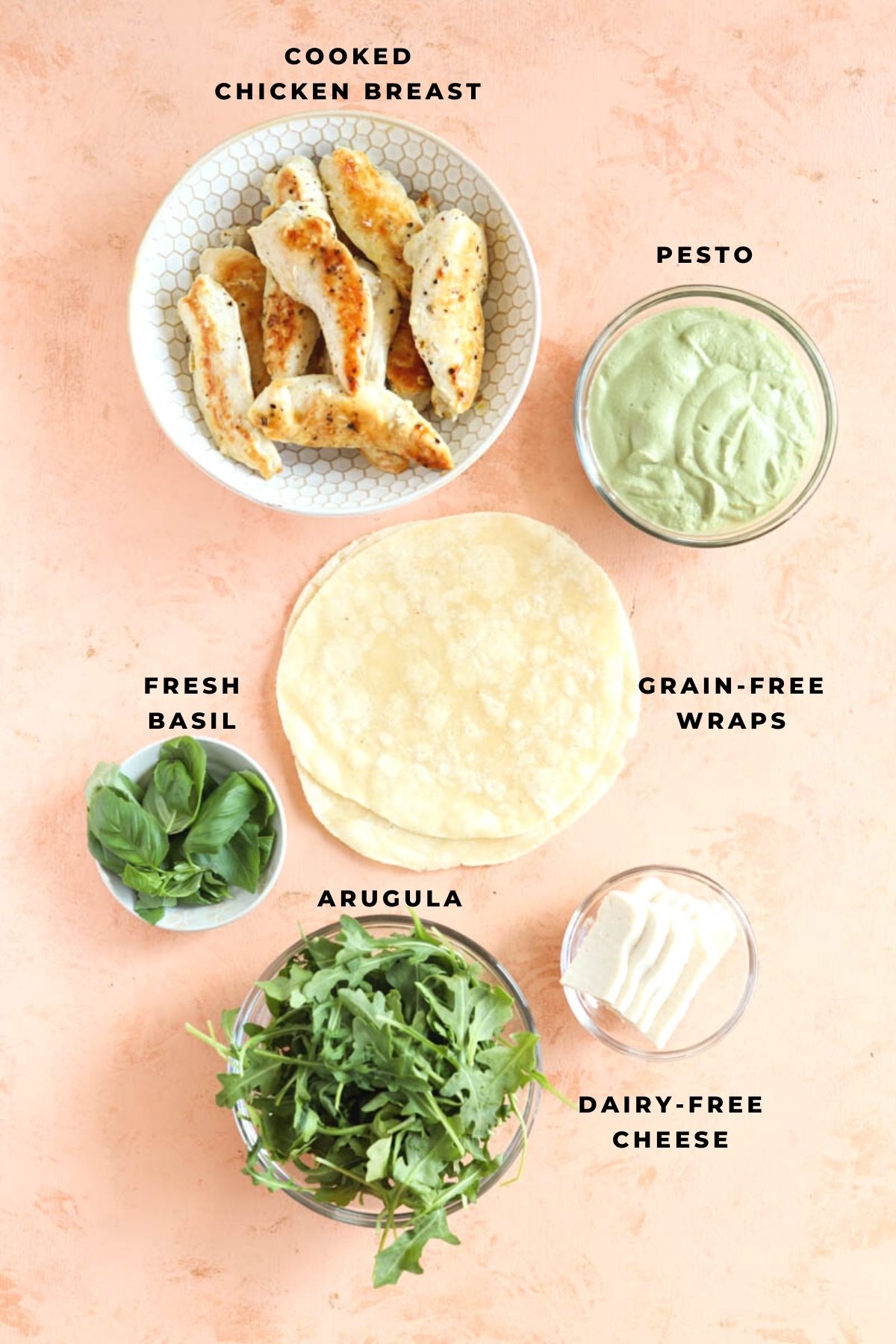 Pesto wrap ingredients measured out into small bowls.