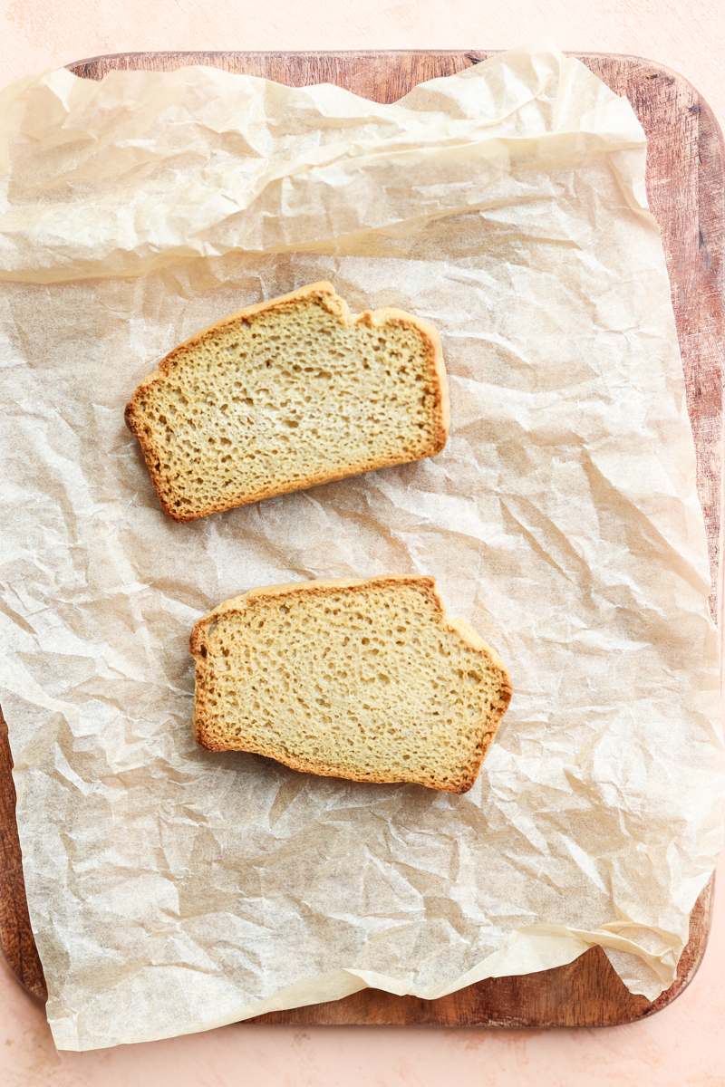 Toast on parchment paper lined cutting board.