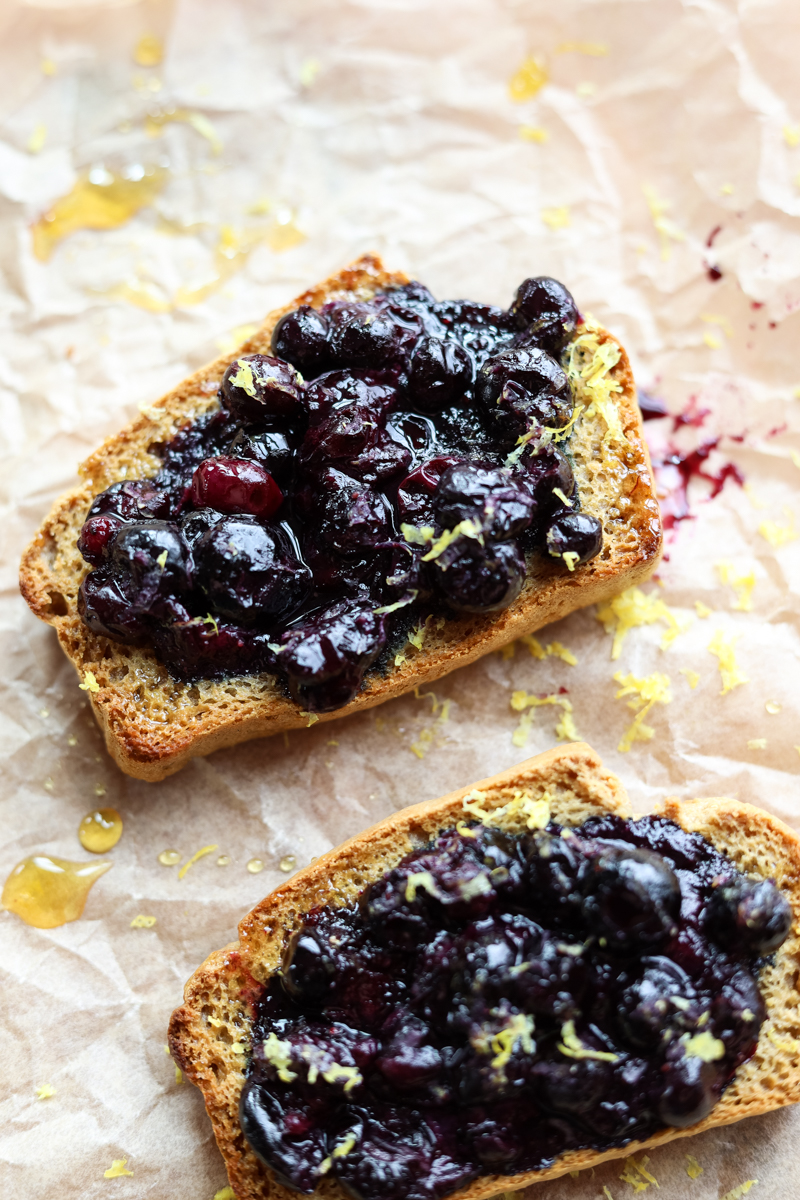 Side angle of blueberry toast with lemon zest.
