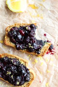 Close up picture of blueberry toast with a bite taken out.