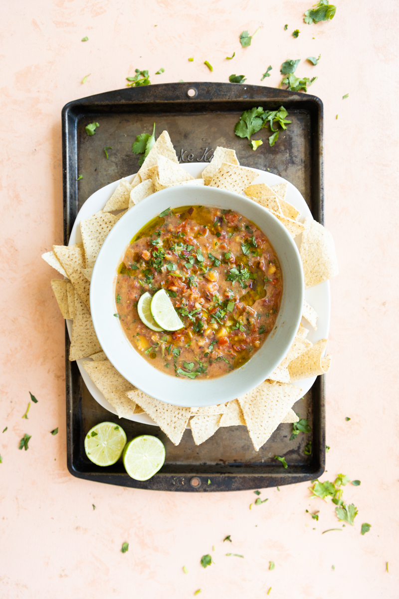 Bowl of peach salsa with chips.