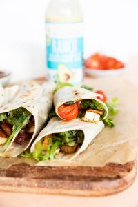 Close up picture of chicken bacon ranch wraps cut in half.