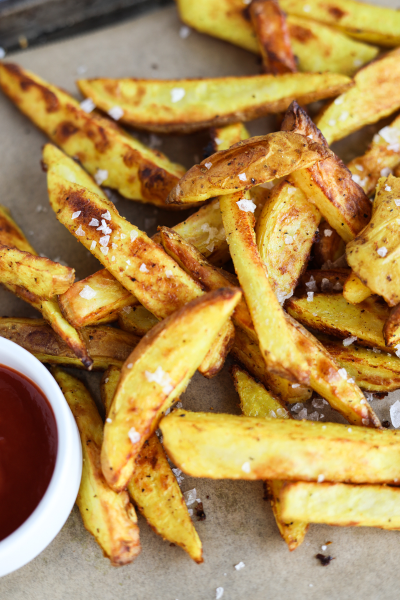 Crispy curry fries on parchment paper.