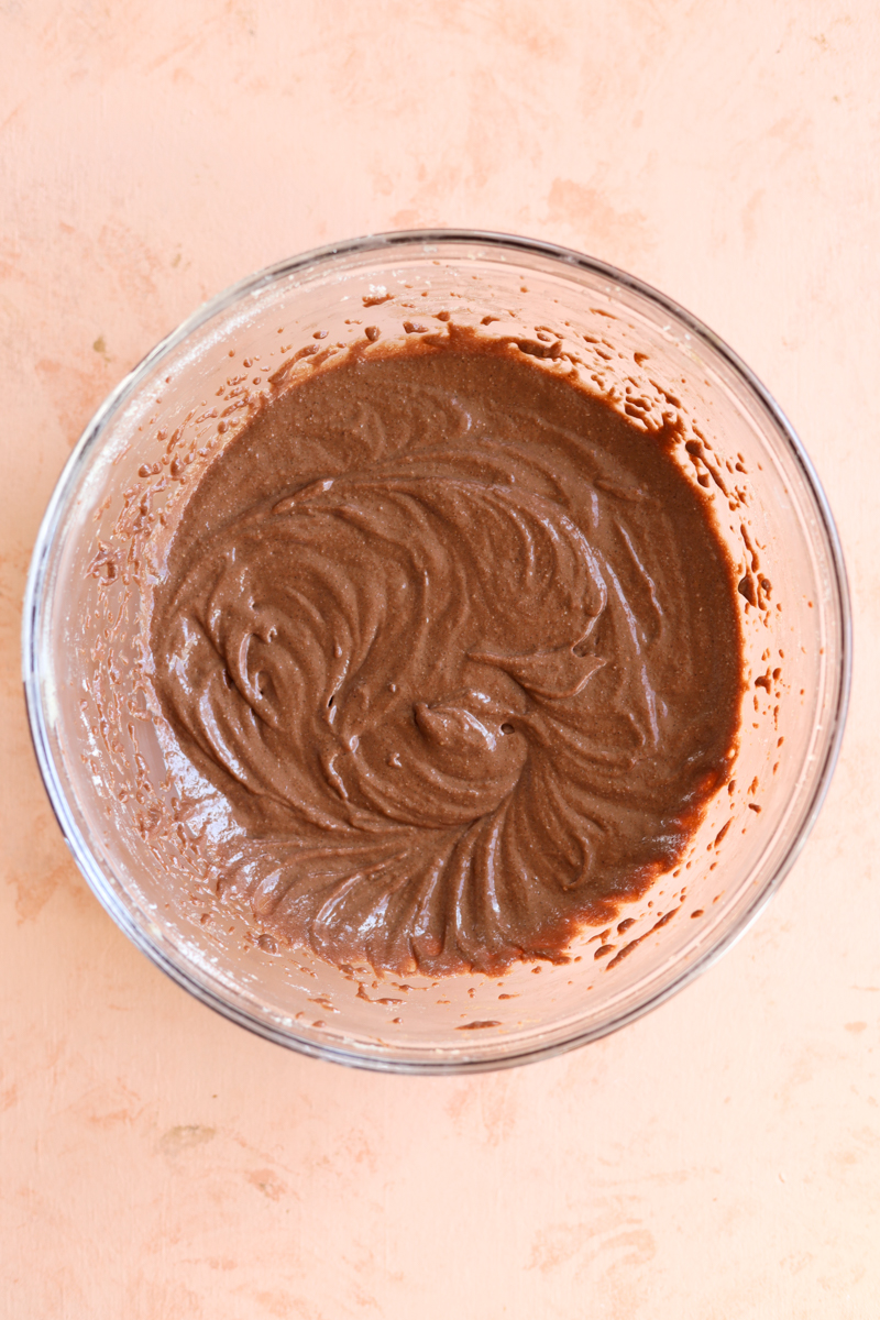 Brownie batter mixed in glass bowl.