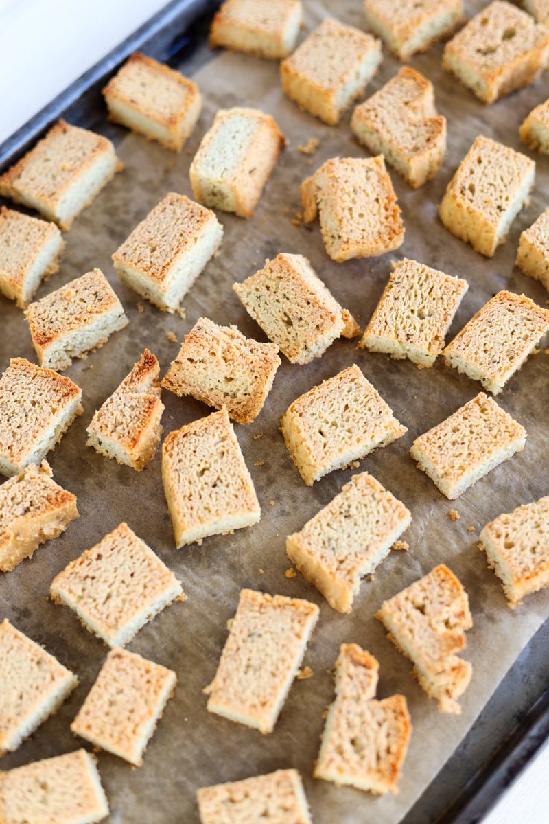 Crispy croutons on a baking sheet.